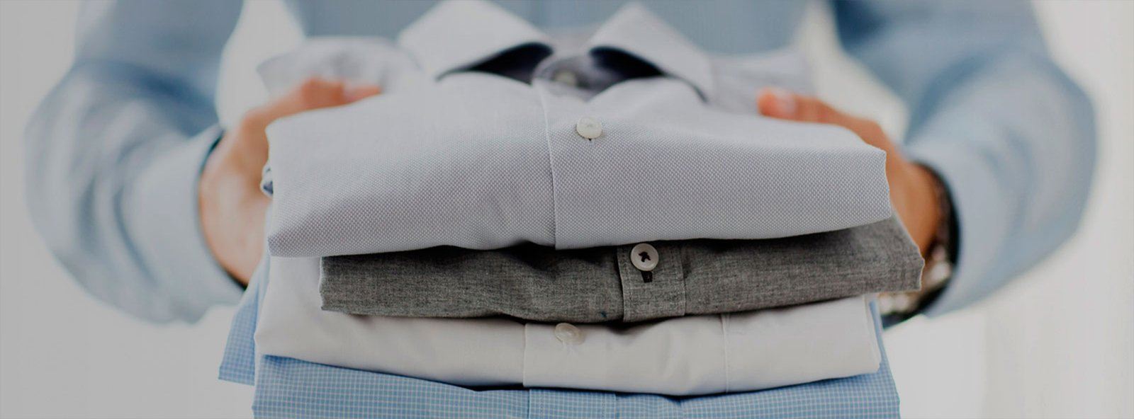 Freshly pressed shirts folded at Lachman Sons Drycleaners